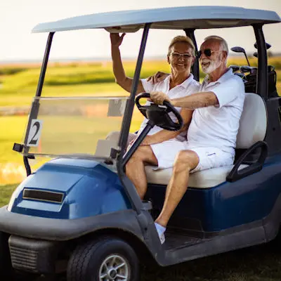 Couple in a golf cart