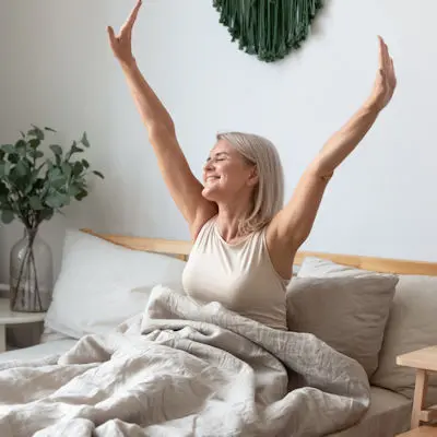 Woman waking up smiling