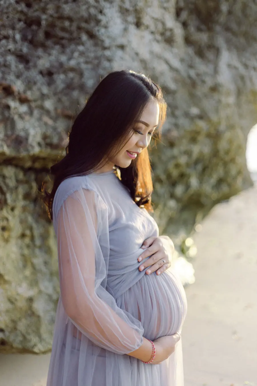 Pregnant woman in lilac