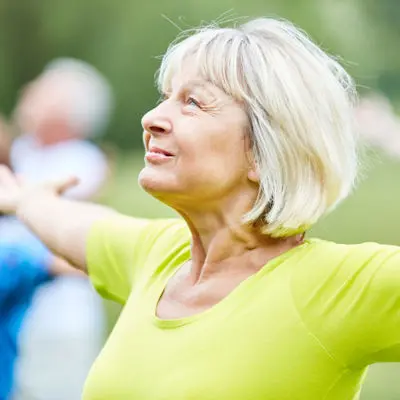 Woman in green taking a breath